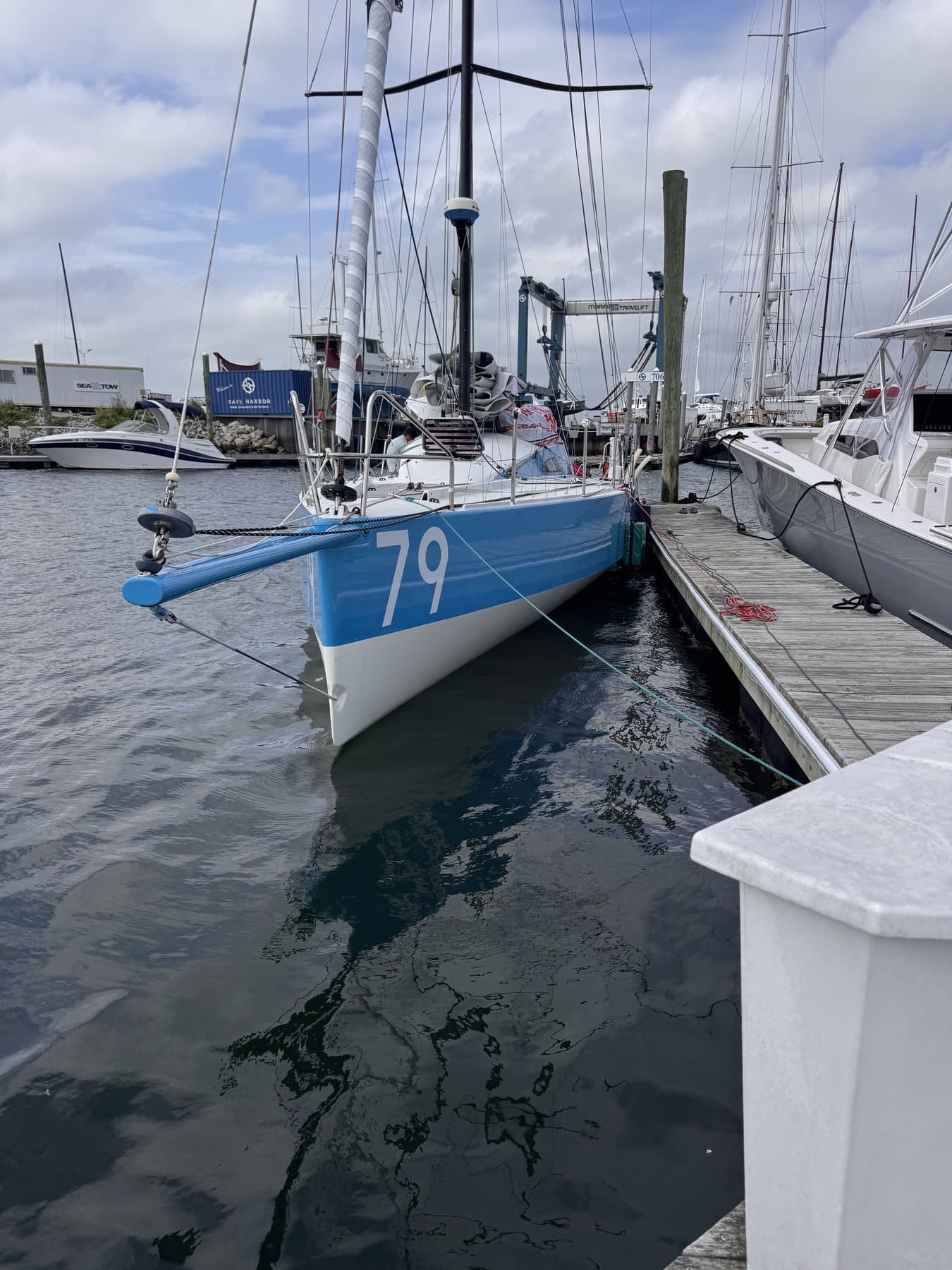 Sailboat docked at a marina slip