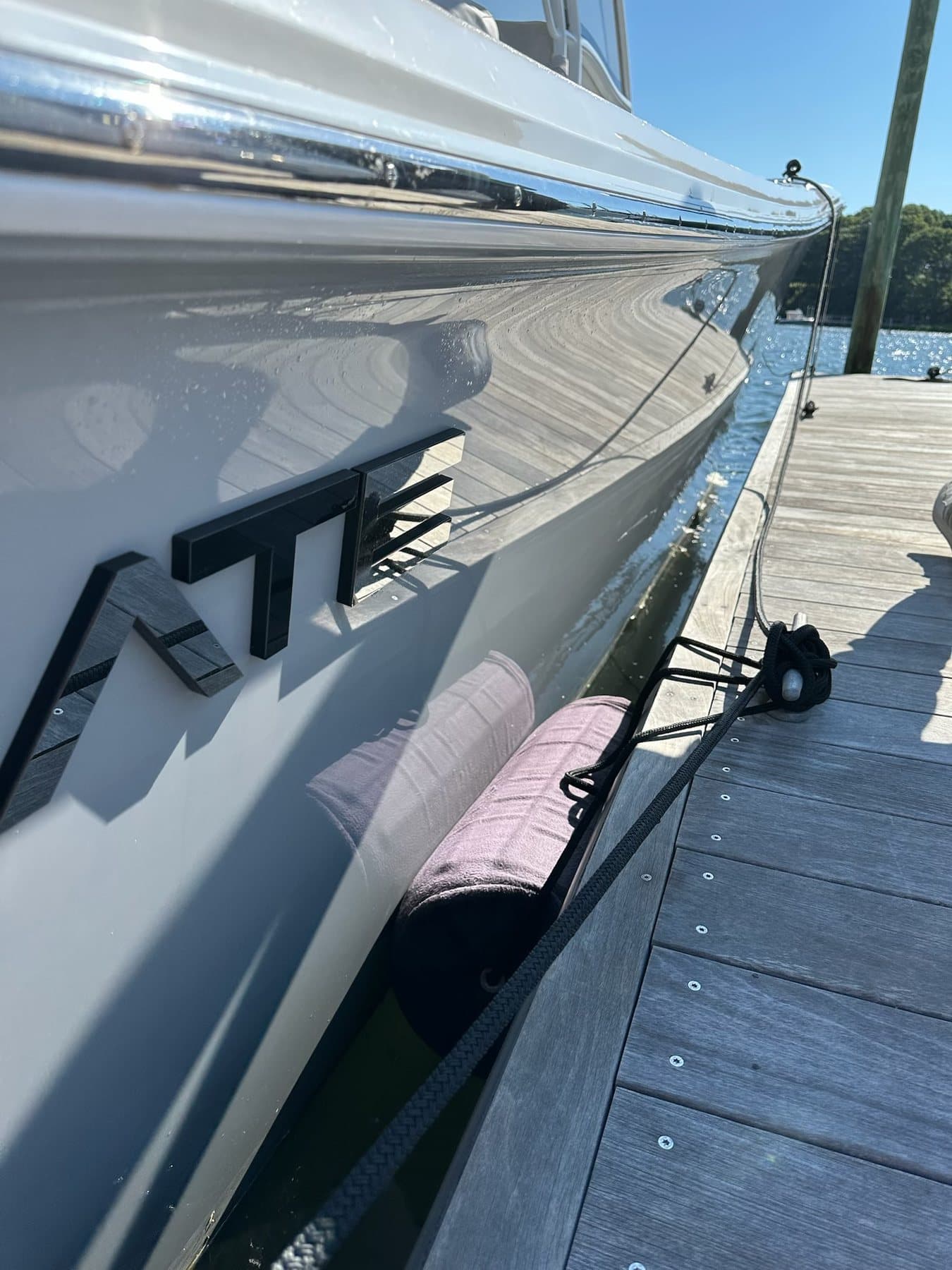 Dockside view along a boat hull before underwater service