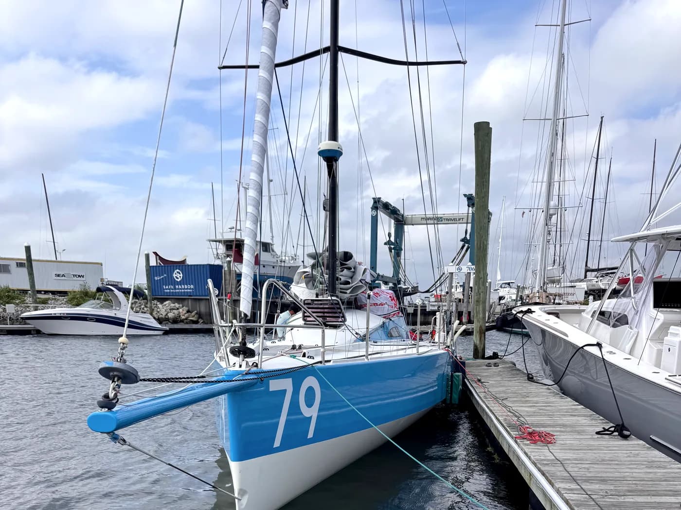 Sailboat docked in a marina slip before underwater service